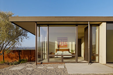 Example of a minimalist one-story flat roof design in San Luis Obispo