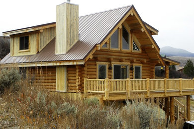 Example of a mid-sized mountain style two-story exterior home design in Denver