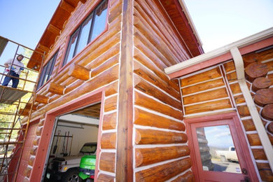 Large rustic exterior home idea in Denver