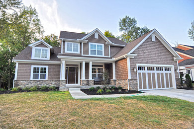 Example of an arts and crafts exterior home design in Columbus