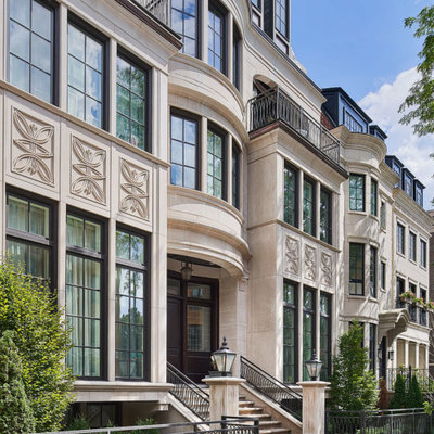 Large elegant beige three-story brick townhouse exterior photo in New Orleans