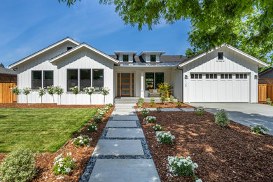 Example of a large farmhouse white one-story wood exterior home design in San Francisco with a shingle roof
