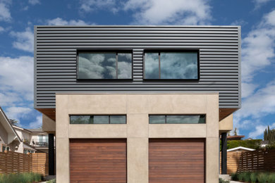 Example of a minimalist two-story metal duplex exterior design in Los Angeles