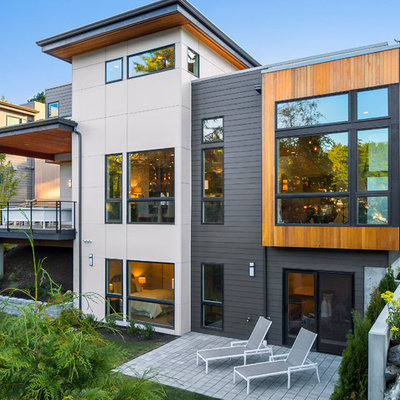 Example of a trendy three-story mixed siding house exterior design in Seattle