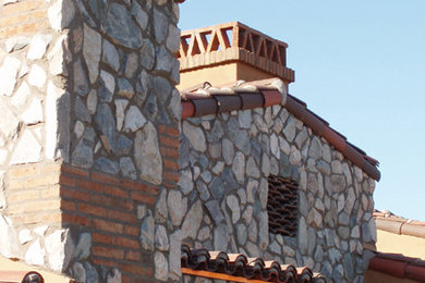 Example of a tuscan exterior home design in Phoenix