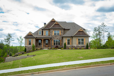 Traditional brown two-story mixed siding house exterior idea in Atlanta with a hip roof and a shingle roof