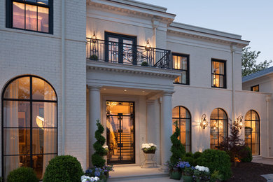 Example of a huge transitional white two-story brick exterior home design in Atlanta