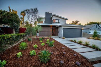 Mid-sized mid-century modern gray two-story stucco exterior home photo in Los Angeles with a shingle roof