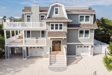 Beach style vinyl house exterior photo in New York with a shingle roof