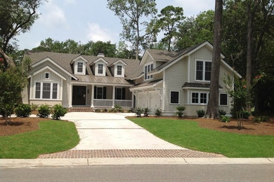 Mid-sized elegant beige two-story vinyl exterior home photo in Atlanta