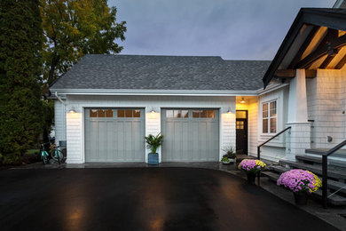 Example of a country white exterior home design in Vancouver