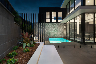 Contemporary black house exterior idea in Melbourne