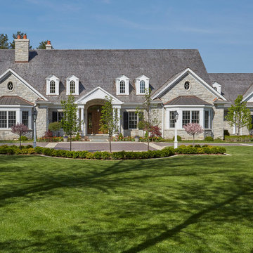 Lush Green Lawn in Front of Traditional Stone Manor
