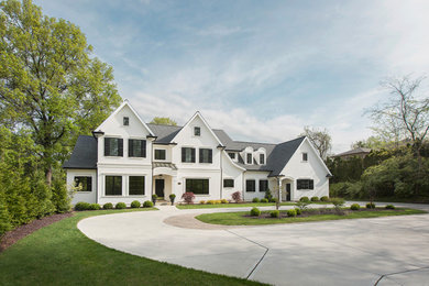 Example of a huge transitional white two-story exterior home design in St Louis with a shingle roof