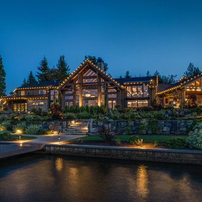 Mountain style brown one-story wood exterior home photo in Seattle