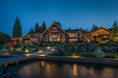 Mountain style brown one-story wood exterior home photo in Seattle