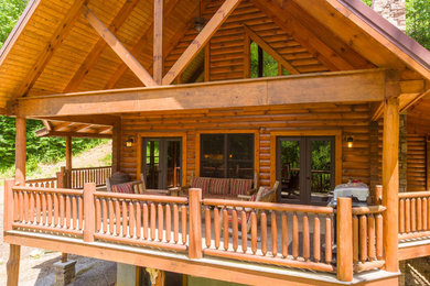 Example of a mountain style wood exterior home design in Other