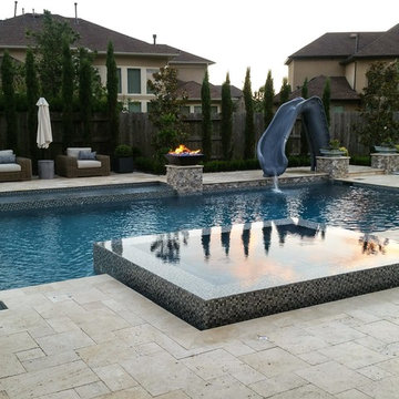 Luxury Swimming Pool with straight lines and perimeter overflow spa