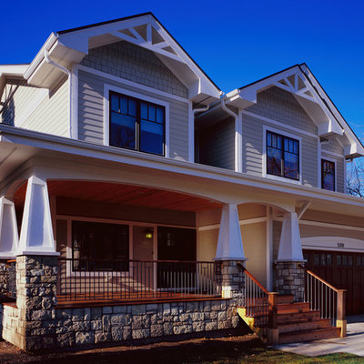 Inspiration for a mid-sized craftsman beige two-story mixed siding house exterior remodel in Chicago with a shingle roof