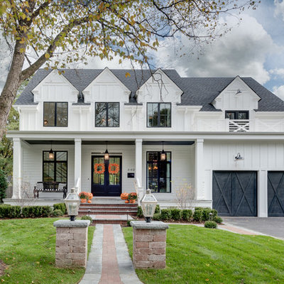Inspiration for a large farmhouse white two-story wood house exterior remodel in Chicago with a shingle roof