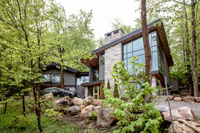 Large craftsman gray two-story mixed siding gable roof idea in Toronto