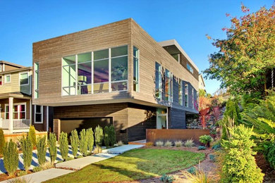 Trendy two-story wood exterior home photo in Seattle
