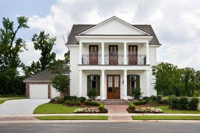 Elegant white two-story mixed siding exterior home photo in New Orleans
