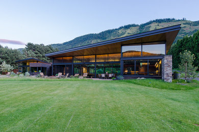 Main House and Master Suite roof mimic the slope of the ridge beyond