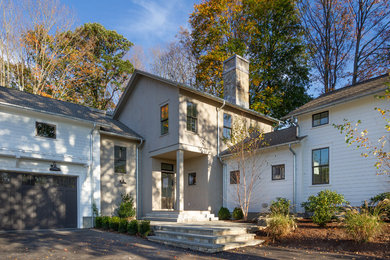 Country multicolored two-story wood house exterior photo in New York with a shingle roof