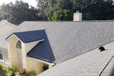 House exterior photo in Orlando with a shingle roof and a gray roof