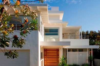 Design ideas for a white contemporary two floor house exterior in Sydney.