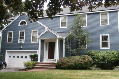 Large traditional blue two-story vinyl gable roof idea in Boston