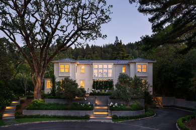 Large transitional white two-story wood house exterior photo in San Francisco with a hip roof and a metal roof