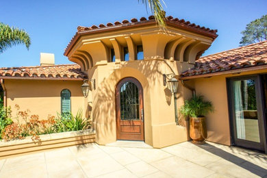Huge transitional beige two-story stucco flat roof photo in Santa Barbara