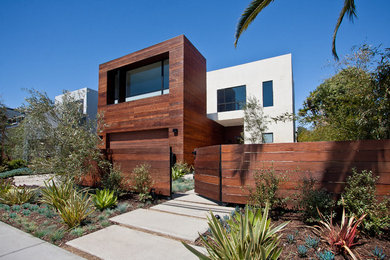 Inspiration for a huge modern white two-story wood flat roof remodel in Los Angeles