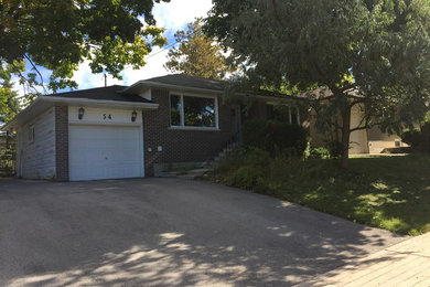 Inspiration for a medium sized and multi-coloured traditional bungalow detached house in Toronto with wood cladding and a shingle roof.