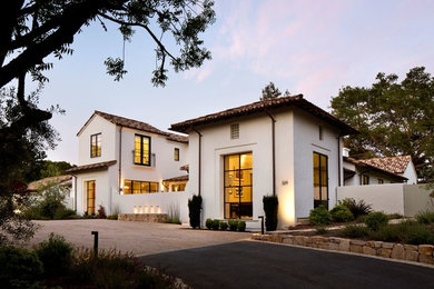 Large minimalist white two-story stucco gable roof photo in San Francisco