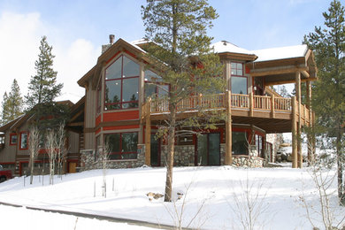 Mid-sized mountain style gray two-story mixed siding exterior home photo in Denver with a hip roof