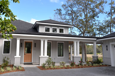 Large transitional gray two-story concrete fiberboard exterior home photo in Jacksonville with a hip roof