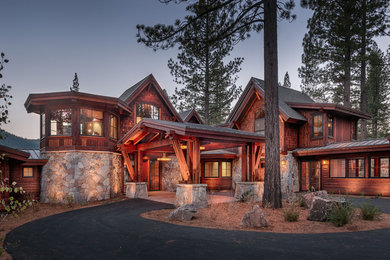 Large mountain style brown two-story mixed siding exterior home photo in Sacramento with a hip roof
