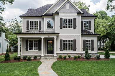 Example of a transitional exterior home design in Raleigh