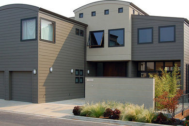 Photo of a medium sized and gey contemporary two floor house exterior in San Francisco with mixed cladding.