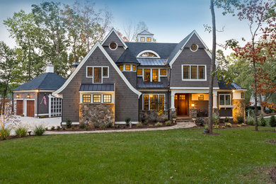 Inspiration for a huge timeless gray three-story wood gable roof remodel in Charlotte