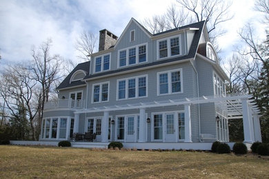 Example of a huge classic blue three-story concrete fiberboard house exterior design in Baltimore with a shingle roof