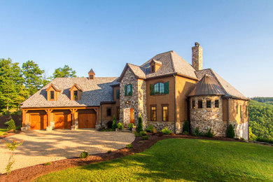 Huge mountain style brown three-story wood exterior home photo in Charlotte