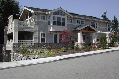 Example of a large classic gray two-story mixed siding exterior home design in Seattle with a shingle roof