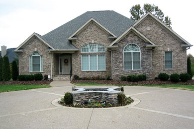 Large arts and crafts gray one-story stone exterior home photo in Nashville with a shingle roof