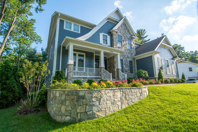 Inspiration for a large timeless blue two-story mixed siding gable roof remodel in DC Metro