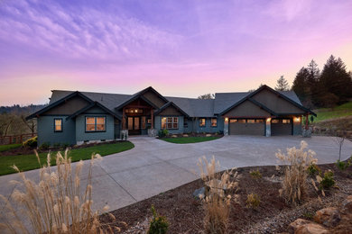 Inspiration for a large craftsman gray two-story mixed siding house exterior remodel in Portland with a hip roof and a shingle roof