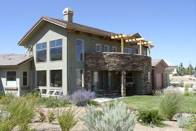 Example of a mid-sized arts and crafts exterior home design in Other